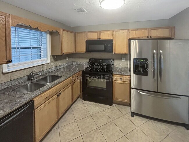 Foto del edificio - 5542 Pine Gate Dr