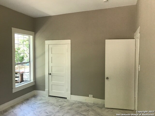 2nd rommy bedroom, with 4 large windows, and AC unit . - 217 Rigsby Ave