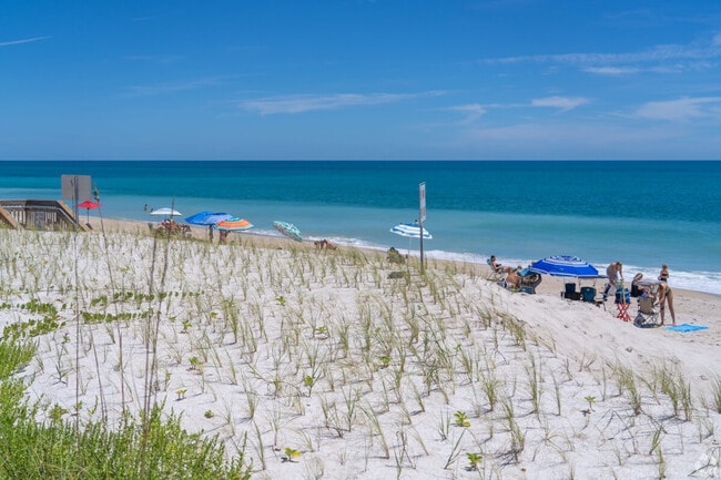 Enjoy a day at the beach in Waterway Village, where the sun meets the sea.