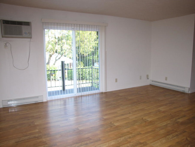 One bedroom living room - Town & Country Apartments