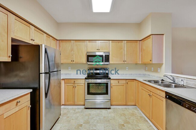 Building Photo - Rare Ground-Floor, End Unit with massive b...
