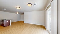 This well-designed single-story residence offers 1090 square feet of thoughtfully arranged living space. The home features three bedrooms, including a primary bedroom of 170 square feet, and two full bathrooms. The heart of the home is a modern kitchen equipped with stainless steel appliances, rich wood cabinetry, and elegant granite countertops. An open-concept layout seamlessly connects the kitchen to the living area, creating an ideal space for both everyday living and entertaining.

Throughout the home, light wood flooring adds warmth and continuity, while large windows flood the rooms with natural light. The bathrooms are fitted with clean, white fixtures, including a combination shower-tub unit. For added convenience, the property includes an in-unit laundry room with a washer and dryer.

The bedrooms are generously sized, with ample closet space and large windows. One room features sliding glass doors leading to an outdoor area, extending the living space. The neutral color palette and recessed lighting contribute to the home's modern, airy ambiance. Located at 211 Sacandaga Rd in Schenectady, NY, this property offers a blend of comfort, style, and functionality in a single-level layout.