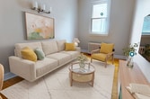 This 57 square meter apartment, located at 260 Dalhousie Street in Ottawa, offers a thoughtfully designed living space spread across a single floor. The property boasts three bedrooms, including a primary bedroom of 13 square meters, and two bathrooms, making it suitable for small families or professionals seeking a urban lifestyle.

The interior showcases a modern aesthetic with a harmonious blend of neutral tones and pops of color. The living area features a comfortable sofa, accent chairs, and a round coffee table, all set on a geometric-patterned rug. Large windows allow natural light to flood the space, while stylish artwork adorns the walls, adding visual interest.

The bedrooms are well-appointed, with the primary bedroom featuring a rattan headboard, wooden nightstand, and contemporary lighting fixtures. Artistic prints and carefully chosen decor elements create a serene atmosphere in these personal spaces.

The kitchen, though compact, is efficiently designed with modern appliances and a marble-topped island, perfect for meal preparation. Throughout the apartment, hardwood floors add warmth and character, while radiators provide heating during colder months.

With four hallways connecting the various rooms, the layout ensures easy movement and flow within the space. The apartment's design successfully balances functionality with style, offering a cozy yet sophisticated urban dwelling in the heart of Ottawa.