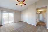 Located at 2600 Sablewood Dr in Bakersfield, California, this single-story, 3-bedroom, 2-bathroom home offers a thoughtfully designed layout with comfortable living spaces throughout. The living room is a standout area, featuring soaring vaulted ceilings, a ceiling fan, plush carpet flooring, and a sliding glass door that opens to a private balcony — allowing natural light to fill the room and providing pleasant outdoor views. The kitchen and dining area are finished with warm-toned wood cabinetry, granite countertops, tile flooring, and stainless steel appliances including a dishwasher, offering a functional and attractive space for cooking and dining. Each of the three bedrooms is carpeted and equipped with ceiling fans, with the primary bedroom offering a dedicated walk-in closet with built-in shelving. Additional bedrooms feature sliding door closets and easy access to the connecting hallway. The bathrooms are clean and practical, with one featuring a full tub-shower combination with white tile surround. A dedicated laundry area adds everyday convenience. With five closets total and neutral tones throughout, this home provides ample storage and a cohesive, move-in ready aesthetic well-suited for comfortable living in Bakersfield.
