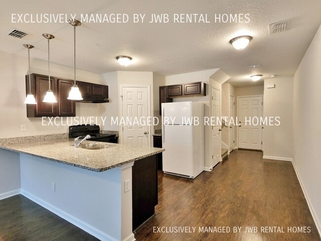 Building Photo - 8409 McGirts Village Ln