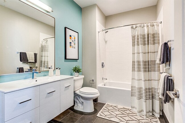 Spa-inspired baths with built-in linen cabinets - Velo Forest Hills Apartments