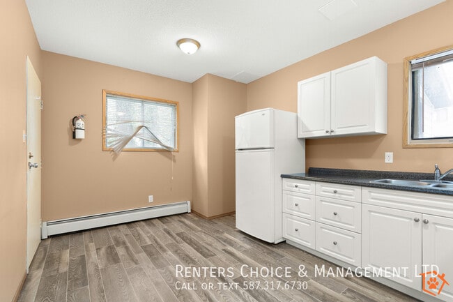 Building Photo - MAIN FLOOR UNIT With Assigned Parking