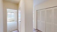 Located at 925 25th St NW in Washington, DC's Foggy Bottom neighborhood, this 1-bedroom, 1-bathroom unit offers a practical and well-lit layout across a single floor. The open living and dining area is bathed in natural light, courtesy of large floor-to-ceiling windows that frame views of the surrounding streetscape. Light-toned hardwood-style flooring runs throughout this space, lending a clean, contemporary feel to the interior. The kitchen is efficiently designed, featuring white cabinetry, stainless steel countertops, a stainless steel sink, a dishwasher, and a gas range — providing a functional workspace for everyday cooking. The bedroom is a comfortable, carpeted retreat with its own set of windows that invite natural light and offer neighborhood views, along with a closet for storage. The full bathroom is neatly appointed with white tile flooring, a pedestal sink, and bright overhead lighting above a wall-mounted mirror, maintaining a clean, classic aesthetic. Throughout the unit, neutral wall tones and white trim create a cohesive and understated palette. The layout flows logically between rooms, making efficient use of the available space. This unit offers a straightforward urban living experience in a prime Washington, DC location.