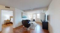Located in Escondido, CA, this well-appointed 3-bedroom, 2-bathroom residence offers a thoughtfully designed single-level layout. The open-concept living and kitchen area serves as the heart of the home, featuring warm hardwood-style flooring that flows throughout. The kitchen is equipped with stainless steel appliances, including a refrigerator, range, microwave, and dishwasher, complemented by rich dark cabinetry, granite countertops, pendant lighting, and a breakfast bar with seating — ideal for casual dining and entertaining. The living room is bright and welcoming, with natural light streaming through sliding glass doors and ample space for comfortable seating arrangements. The spacious primary bedroom includes a ceiling fan, natural light from a window, and generous closet space with mirrored sliding doors. The two bathrooms feature tub-shower combinations, granite vanity tops, and built-in shelving. Both bathrooms are accessible from a shared hallway lined with mirrored closets. A standout feature of this residence is the expansive outdoor terrace, adorned with large planter boxes, decorative stonework, and lush palm trees, offering a serene outdoor retreat with open views of the surrounding Escondido neighborhood.