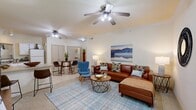 Located in Yukon, Oklahoma, this single-story, 3-bedroom, 1-bathroom home offers a well-organized layout that maximizes every square foot of its compact footprint. The open-concept living and dining area serves as the heart of the home, featuring ceiling fans, light-toned walls, and a bright window that invites natural light and outdoor views. The space comfortably accommodates both a seating arrangement and a dining table, creating a versatile and welcoming environment.

The kitchen is efficiently designed with white cabinetry, ample counter space, tile flooring, and a full suite of appliances including a range, microwave, refrigerator, and sink. A breakfast bar with seating connects the kitchen to the living area, enhancing the open flow of the space.

Each of the three bedrooms is finished with soft carpeting and ceiling fans, offering a comfortable retreat. The primary bedroom provides a generous layout with access to a closet. The single full bathroom features tile flooring, a tub-shower combination with sliding glass doors, and overhead cabinetry for storage.

A hallway connects the bedrooms and bathroom, keeping the floor plan organized and functional. Throughout the home, the neutral color palette and consistent finishes create a cohesive, understated aesthetic.