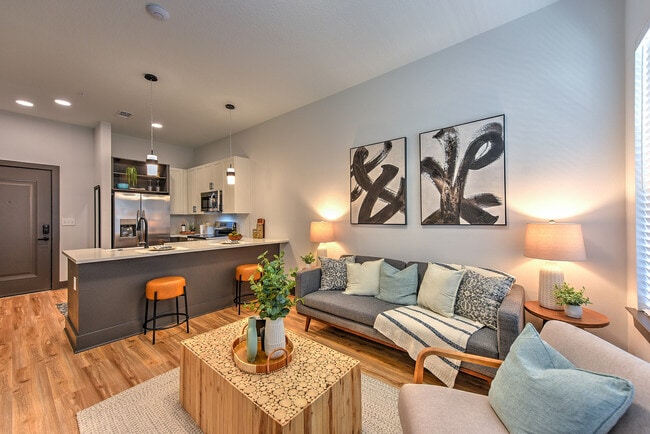 Experience the blend of comfort and style in this contemporary open-concept living area. - The Jack