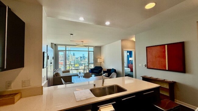 Building Photo - FURNISHED Modern 1BR + Den/1BA w/ Breathta...
