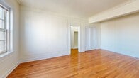 Located on the 12th floor at 135 S 20th St in Philadelphia's vibrant Rittenhouse Square neighborhood, Unit 1204 is a thoughtfully designed studio that blends classic architectural character with functional living. The main living area is bright and open, showcasing warm hardwood floors that run throughout, elegant wall paneling with decorative molding, and crown molding at the ceiling. Multiple double-hung windows invite abundant natural light and frame city views, enhancing the airy feel of the space. A dedicated closet and a connecting hallway provide practical storage and flow between rooms. The galley-style kitchen is both charming and efficient, featuring white cabinetry with glass-front accents, a granite-look countertop with an integrated sink, a gas range, and a full-size refrigerator. A bold geometric tile floor in grey and white adds a timeless, classic touch. The bathroom continues the vintage aesthetic with white penny-round mosaic tile flooring, subway-tiled walls, a pedestal sink, a full soaking tub with shower, and a window that brings in natural light. Overall, the unit exudes a classic pre-war character that is both inviting and functional.