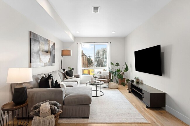 Building Photo - Modern 2-Bedroom Rowhome with Rooftop Moun...