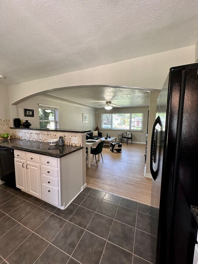 Kitchen Opening to Living Room and Eat In Area - 1856 S Monroe St