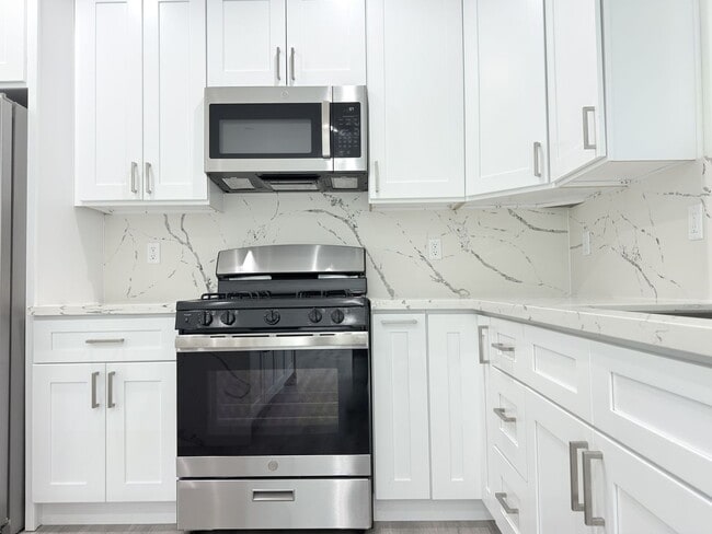 Building Photo - Chic Modern Living in Panorama City – 4 Be...
