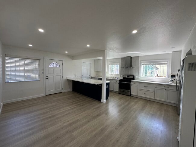 Bright & open layout with wide-plank floors and recessed LED lighting. - 721 15th St