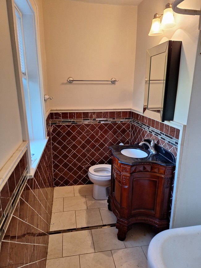 Mohogany cabinet,tiled walls,granite flooring - 4215 N Campbell Ave