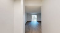 Located at 2800 Paces Ferry Rd SE in Atlanta, Georgia, this two-bedroom, two-bathroom residence offers a well-organized single-floor layout designed for comfortable everyday living. The living room features light wood-style flooring and a sliding glass door that floods the space with natural light and opens to an outdoor balcony view. The open connection to the kitchen creates a seamless flow, with the kitchen showcasing white shaker-style cabinetry, granite-look countertops, a mosaic tile backsplash, stainless steel appliances, and matching light wood flooring throughout. Both bedrooms are finished with plush neutral carpeting and feature windows that invite natural light. The spacious primary bedroom includes a wide sliding-door closet for ample storage. The two bathrooms are outfitted with full tub and shower combinations, each featuring bold dark stone-look tile surround walls, granite-topped vanities, and clean white fixtures that provide a polished, cohesive aesthetic. Multiple hallways connect the rooms efficiently, and a dedicated closet adds additional storage. Textured ceilings are consistent throughout, lending a classic residential character to the entire space.