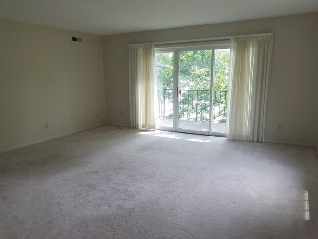Living area opens to the balcony - 1155 Charter Oak Ln