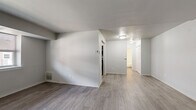 Located at 3241 Hulmeville Rd in Bensalem, PA, this one-bedroom, one-bathroom unit offers a well-organized layout across a single floor. The living room is an open, airy space finished with light wood-style laminate flooring and neutral gray-toned walls, creating a clean and versatile backdrop. Natural light filters in through windows, enhancing the bright and welcoming atmosphere.

The galley-style kitchen is efficiently designed and features dark cabinetry paired with light marble-look countertops, stainless steel appliances including a gas range, microwave, and full-size refrigerator, and a stainless steel sink — all complemented by the same light flooring that carries throughout the common areas.

The bedroom is a comfortable retreat finished with soft wall-to-wall carpeting and natural light from a window with blinds. It includes a double closet with bifold doors, providing generous storage space. The adjacent full bathroom is clean and bright, featuring a tiled tub-and-shower combination, a white vanity with an integrated sink, brushed nickel fixtures, and tile flooring. The unit also includes a dedicated closet for additional storage needs.
