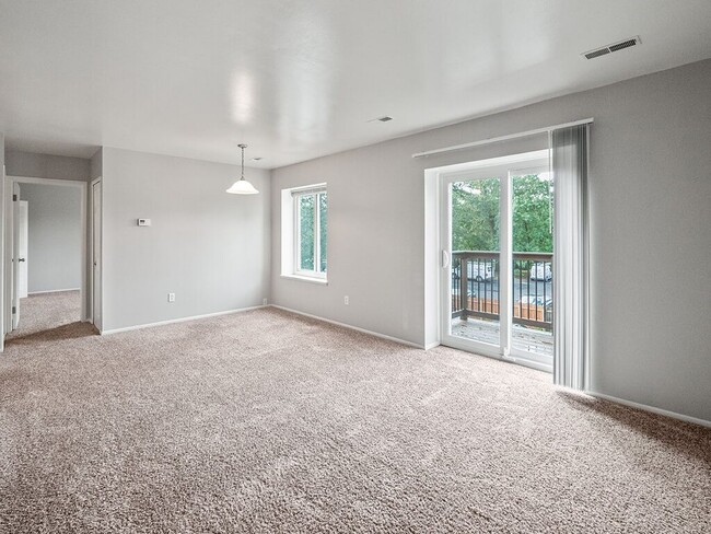 Living Room with Attached Private Balcony - Pine Lake Manor