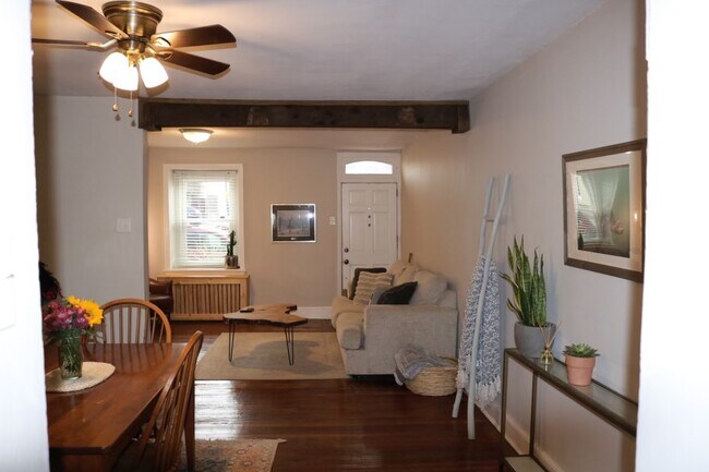 Exposed wood beams and custom radiator cover - 168 Dupont St
