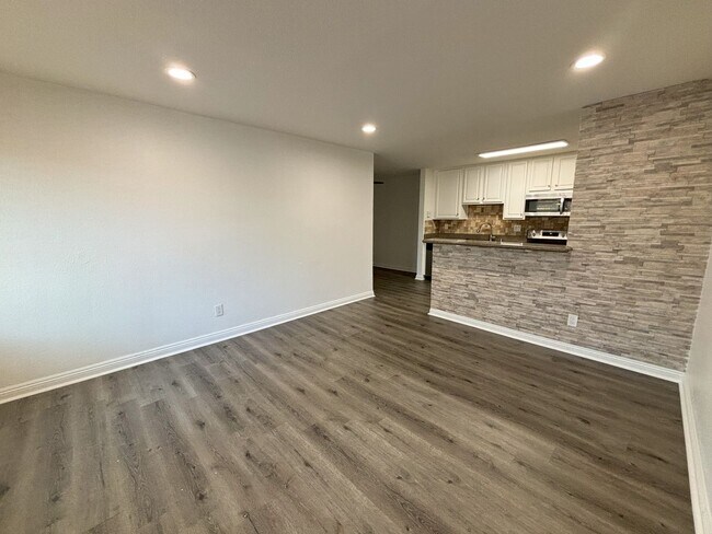 Building Photo - Upstairs Two Bedroom Condo with in-unit La...