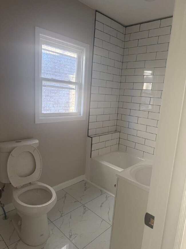 Building Photo - "Charming 4-Bedroom Townhouse in Trenton – Ideal Urban Living on MLK Jr. Blvd!"