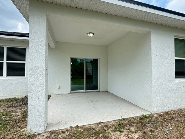 Foto del edificio - Modern 4-Bedroom Home in Poinciana – Get 5...