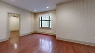 Located on the iconic Canal Street in the heart of New Orleans, this one-bedroom, one-bathroom unit offers a well-designed layout across a single floor. Rich hardwood flooring flows throughout the living and bedroom areas, lending warmth and character to the space.

The kitchen is a standout feature, outfitted with deep-toned wooden cabinetry, granite countertops, and a full suite of stainless steel appliances including a refrigerator, electric range, and over-the-range microwave. A peninsula with an integrated sink provides additional prep space and casual seating, while pendant lighting above adds a refined touch to the area.

The bedroom is generously proportioned, featuring a ceiling fan with recessed lighting, a large window that brings in natural light, and the same warm hardwood flooring found throughout. The dedicated closet provides practical storage.

The bathroom is finished with neutral tile flooring, a tub and shower combination, and clean, understated fixtures. A hallway connects the rooms, contributing to an efficient and logical flow throughout the unit.

With recessed lighting in the main living areas and a neutral color palette on the walls, the space maintains a bright and clean aesthetic. Situated on Canal Street, residents have direct access to the vibrant culture, dining, and transit options that define life in New Orleans.