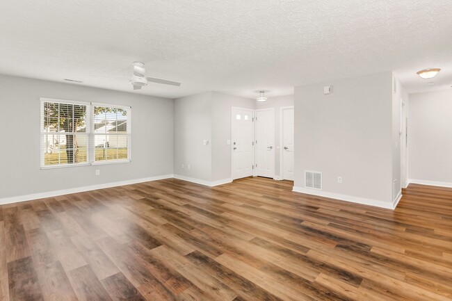 Great room with new luxury vinyl plank flooring - 135 Hancock St