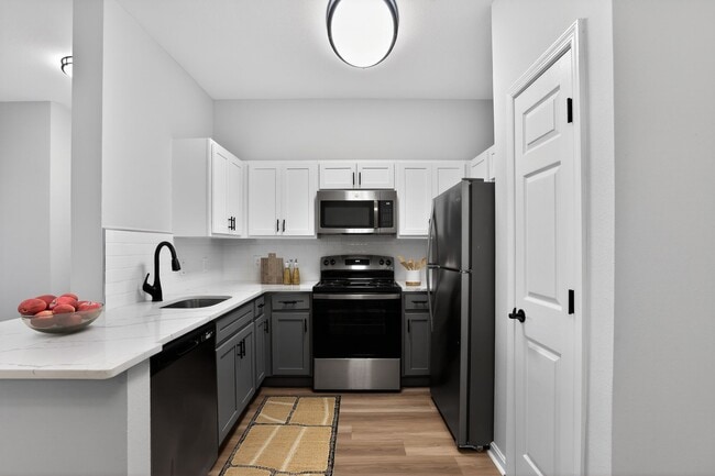 Elevate your lifestyle at Eagle Rock Apartments at Fishkill, where modern design meets functionality in our stylish kitchens. Enjoy spacious layouts and premium appliances that make cooking a pleasure. Schedule your tour today! - Eagle Rock Apartments at Fishkill