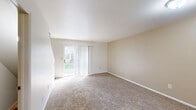 Located at 680 Pinckney Ct NW in Comstock Park, Michigan, this 2-bedroom, 1-bathroom home spans three floors, offering a well-organized layout with a basement, main living level, and an upper floor dedicated to sleeping quarters. The main level features a carpeted living room bathed in natural light from a sliding glass door fitted with vertical blinds, and a staircase with a warm wood handrail leading to the upper floor. The kitchen is equipped with oak cabinetry, white countertops, a double sink, a gas range, and a dishwasher, complemented by tile flooring and a bright window overlooking the outdoors. Both bedrooms are carpeted and feature closets with bi-fold doors, natural light from windows with blinds, and a clean, neutral color palette. The primary bedroom is generously sized with a double-door closet. The full bathroom includes a tub/shower combination with a handheld showerhead and tile flooring. The unfinished basement provides practical utility space, housing the washer and dryer and offering additional storage potential. Throughout, the home features neutral tones, wall-to-wall carpet on the upper levels, and consistent finishes that create a cohesive and functional living environment.