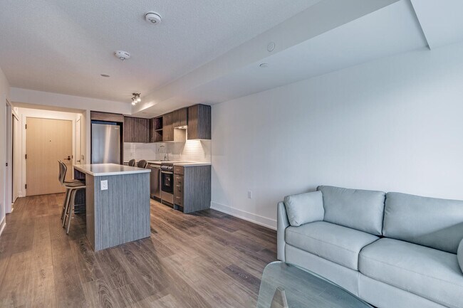Photo du bâtiment - One Plus Den Furnished unit