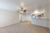 Located in Spring, TX, this 3-bedroom, 2-bathroom single-floor residence offers a well-designed layout that maximizes functionality. The open-concept living, dining, and kitchen area serves as the heart of the home, featuring wood-look flooring that transitions seamlessly into the kitchen. A ceiling fan with integrated lighting keeps the space comfortable, while a window allows natural light to fill the room.

The kitchen is equipped with stainless steel appliances, including a refrigerator, electric range, and over-the-range microwave. Light wood cabinetry provides ample storage, and the stone-look countertops extend to a peninsula that doubles as a breakfast bar. A pantry with louvered bifold doors adds convenient additional storage.

The three bedrooms are carpeted and fitted with ceiling fans. The primary bedroom offers a comfortable footprint with a dedicated closet. The two bathrooms each include a full tub-shower combination with white tile surrounds. Additional highlights include a utility/laundry room, multiple closets throughout, and a hallway connecting the private spaces. The neutral color palette and clean finishes create a bright, move-in-ready atmosphere throughout the home.