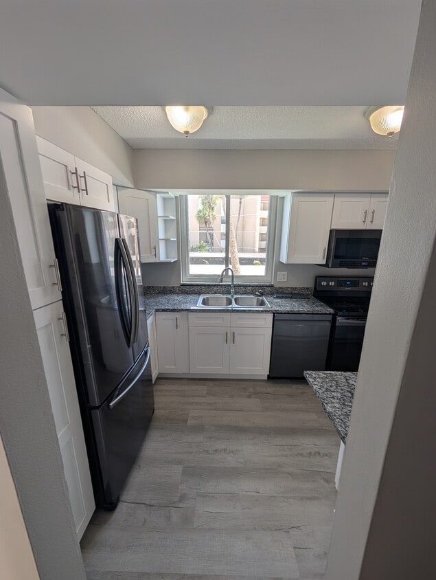 Kitchen with all new cabinets and flooring - 3462 NE Causeway Blvd