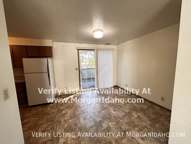 Building Photo - Patio deck, storage room, covered parking.