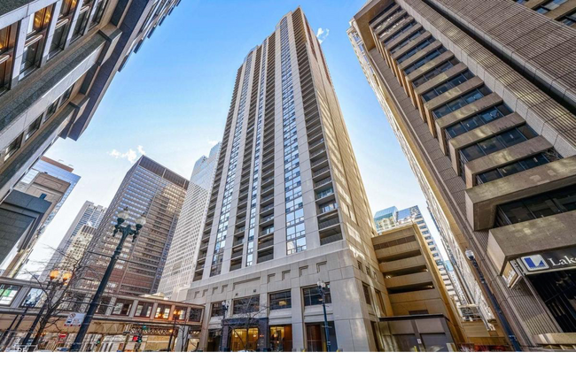 This apt has a floating glass walkway that connects you to banks, stores, food courts, and offices - 200 N Dearborn St