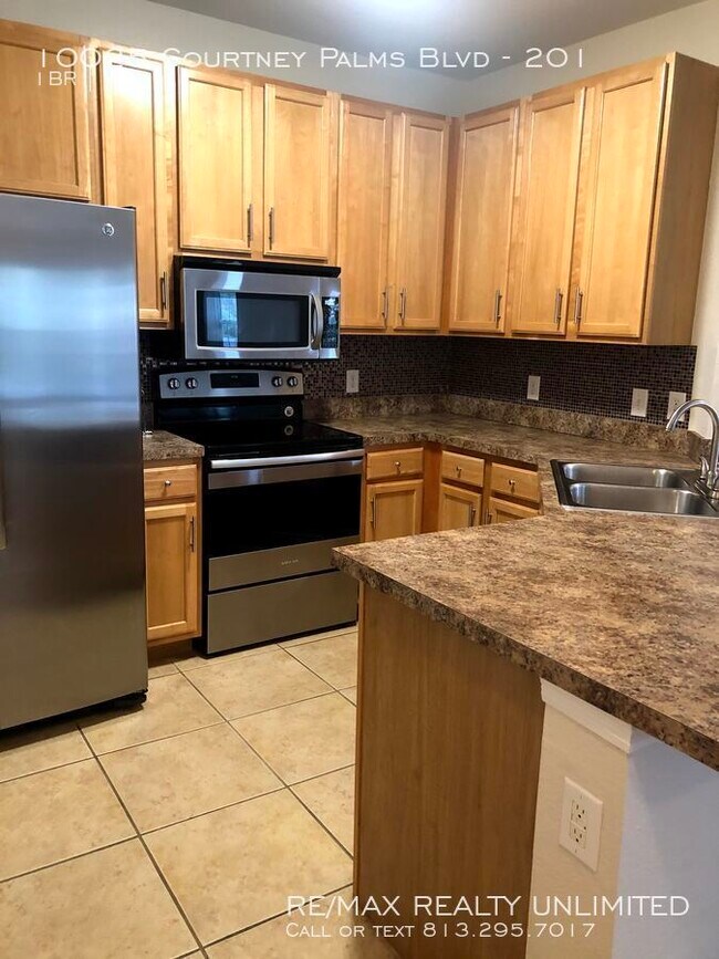 Building Photo - 10025 Courtney Palms Blvd #201 Tampa, FL 3...