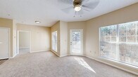 Located at 461 Old Dixie Way in Forest Park, GA, this single-floor, one-bedroom, one-bathroom home offers a practical and comfortable layout with warm neutral tones throughout. The combined kitchen and living area forms the heart of the home, where vaulted ceilings add a sense of openness and a ceiling fan provides year-round comfort. Multiple windows and a private exterior door flood the carpeted living space with natural light and provide outdoor access. The kitchen is laid out in a galley style, featuring white cabinetry with wood-tone trim, stainless steel appliances including a refrigerator and electric range, white countertops, and wood-look flooring that adds a clean, modern touch. A peninsula counter connects the kitchen to the living area, ideal for casual dining or additional prep space. The bedroom is a well-proportioned retreat with plush carpeting, a large window overlooking the outdoors, and direct access to both a dedicated closet and the full bathroom. The bathroom is equipped with a single-sink vanity with white cabinetry, a large mirror, a tiled shower-tub combination, and wood-look flooring. This home offers a cohesive and functional living experience in a convenient Forest Park location.