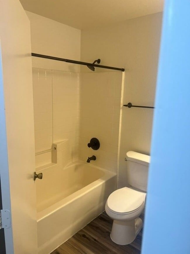 Building Photo - This three bedroom has the primary bedroom on the downstairs level.