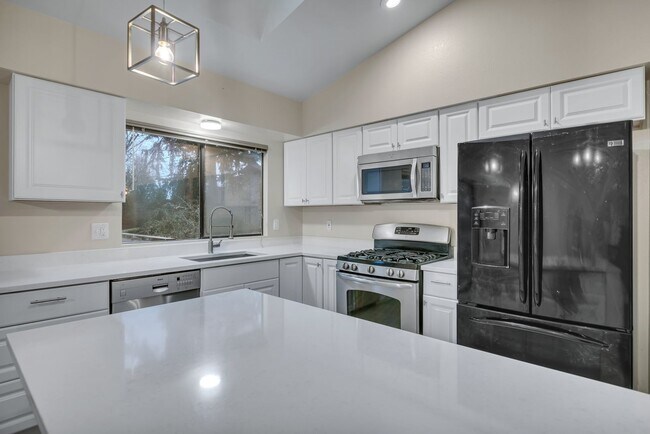 Building Photo - 4 bedroom home - Extra Large Fenced backyard