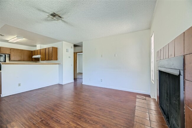 Building Photo - 2nd Story 2-Bed Condo with Tile Fireplace
