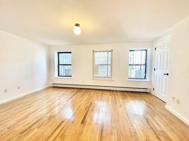 Building Photo - 61-25 Woodside Ave