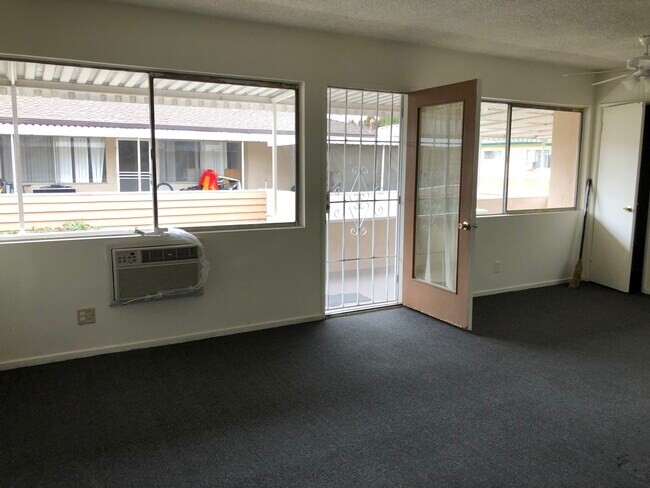 Part of larger living room- door to patio - 6661 Rhodes Ave