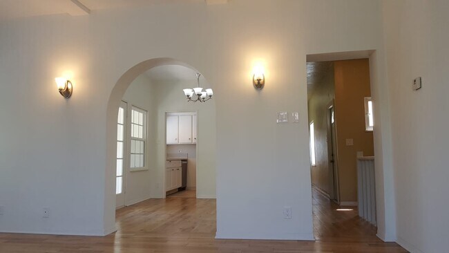 Living room view...looking into dining room, balcony, and kitchen - 1944 N Hoover St