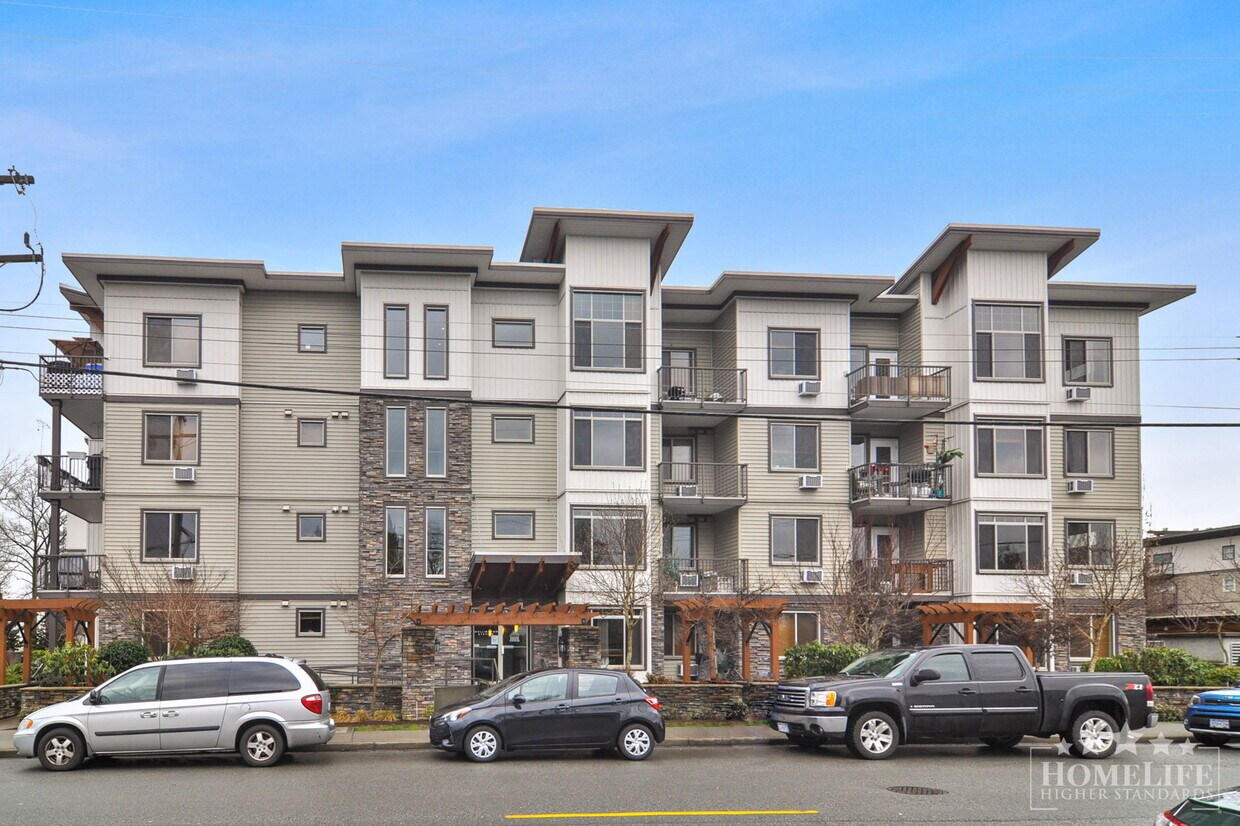 Photo principale - Exceptional Condo Living in the Heart of Maple Ridge — 1 Bed Plus Den / 1 Bath Corner Unit at Wel...
