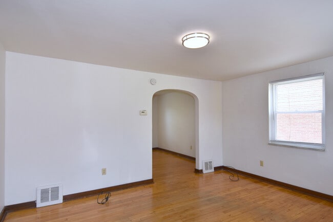 Living Room refinished original wood floors and new LED lighting - 3004 Willett Rd