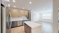 This contemporary apartment in Fort Washington, PA, offers 1120 square feet of thoughtfully designed living space. The single-story layout encompasses three bedrooms, including a spacious 160 sq ft primary bedroom, and two full bathrooms. The heart of the home is an open-concept kitchen and living area, featuring a sleek, modern kitchen with stainless steel appliances, two-tone cabinetry, and a central island. Light wood-look flooring flows throughout the main living areas, while plush carpeting adds comfort to the bedrooms. Large windows with horizontal blinds allow for ample natural light and privacy control. The bathrooms boast modern fixtures, including a tub-shower combination with marble-look tiling. A dedicated laundry room and three closets provide practical storage solutions. Recessed lighting throughout enhances the apartment's bright, airy ambiance. This well-appointed space at 1125 Virginia Dr combines style and functionality, offering a comfortable and contemporary urban living experience.